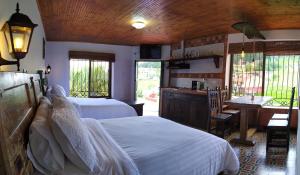 Postel nebo postele na pokoji v ubytování Cabañas & Glamping De Ruana Por Boyacá