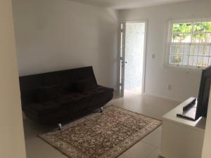 Posezení v ubytování Linda casa frente mar- praia de Porto Belo