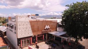 an overhead view of a building with a sign on it at Merlin Hotel in Maumere
