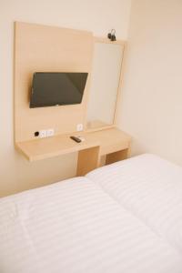 Merlin Hotel客房内的一张或多张床位