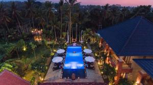 an overhead view of a swimming pool at a resort at Bubu Suite by Prasi in Ubud