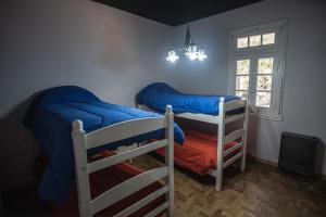 Un pat sau paturi într-o cameră la El Rolito +39 fotografii