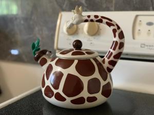 a spotted teapot sitting on a stove at Casa De Pedro Entire Apartment in Mangilao