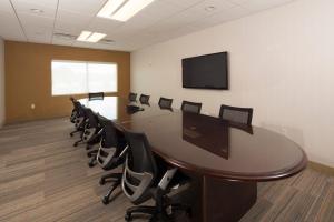 a conference room with a long table and chairs at Holiday Inn Express Rochester Hills by IHG in Rochester Hills +24 photos
