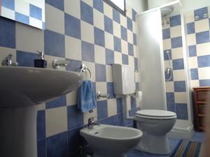 a bathroom with a sink and a toilet at Antico Borgo in Castiglione di Sicilia