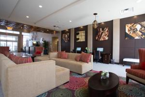 a large living room with couches and a table at Holiday Inn Murfreesboro, an IHG Hotel in Murfreesboro