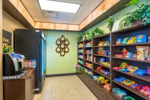 a store aisle with shelves of food and plants at Holiday Inn Murfreesboro, an IHG Hotel in Murfreesboro