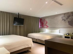 מיטה או מיטות בחדר ב-Wholesome Hotel