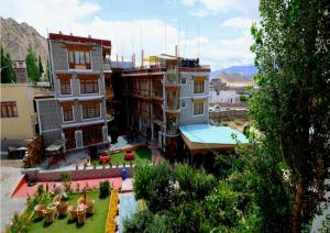 a group of buildings with a yard in front at Hotel Royal Palace - Leh in Leh