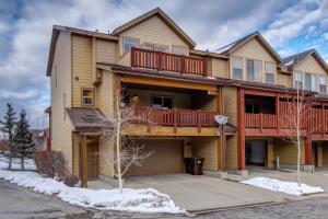 a large house with a balcony with red decks at Luge Lane townhouse in Park City