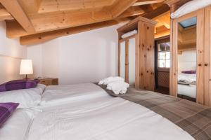 Postel nebo postele na pokoji v ubytování Hotel Bella Vista Zermatt