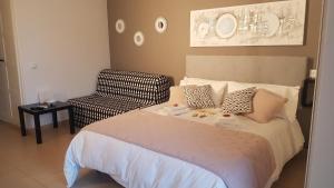 A bed or beds in a room at Apartamentos Minerva- Jupiter