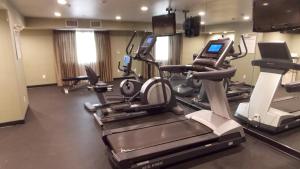 a gym with cardio machines and a treadmill at Holiday Inn Express Bakersfield, an IHG Hotel in Bakersfield