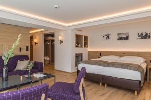 Postel nebo postele na pokoji v ubytování Hotel Bella Vista Zermatt