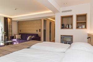 Postel nebo postele na pokoji v ubytování Hotel Bella Vista Zermatt