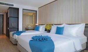 Postel nebo postele na pokoji v ubytování Seana Hotel