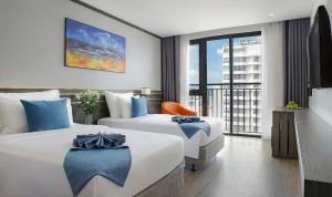 Postel nebo postele na pokoji v ubytování Seana Hotel