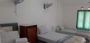 Postel nebo postele na pokoji v ubytování Diyah Homestay