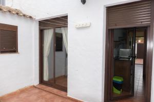 a door to the outside of a house at Casa Real la Barrosa in Chiclana de la Frontera