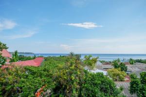 a view of the ocean from a resort at RedDoorz @ Hotel Aulia Majene in Majene