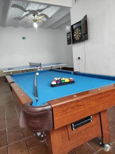 a pool table in a billiard room with at CASA RURAL LA CARRIONA in Segura de León