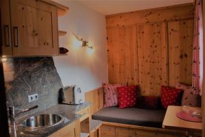 a kitchen with a sink and a counter at Appartements Griesserhof in Oetz