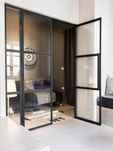 A bed or beds in a room at Sophia Aegina