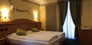 Katil atau katil-katil dalam bilik di Albergo Bernard