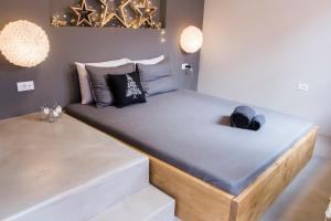 A bed or beds in a room at Sophia Aegina