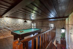 a room with a pool table on a staircase at Quinta S. Romao do Neiva in Castelo do Neiva