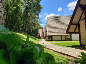 a row of cottages at a resort at Hotel Pousada das Flores in Gramado