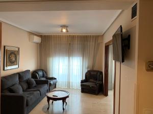 A television and/or entertainment centre at Apartamentos Torr en Madrid - Chamartín