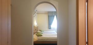 Katil atau katil-katil dalam bilik di Albergo Bernard