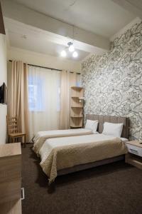 
Кровать или кровати в номере Отель Бегемот Маяковская
