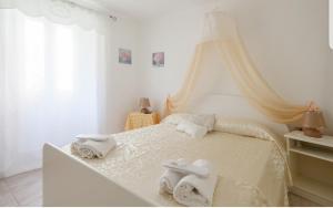 Posteľ alebo postele v izbe v ubytovaní ControVento Apartament II