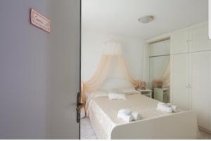 Posteľ alebo postele v izbe v ubytovaní ControVento Apartament II