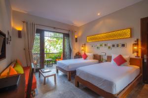 Voodi või voodid majutusasutuse Hoi An Chic - Green Retreat toas