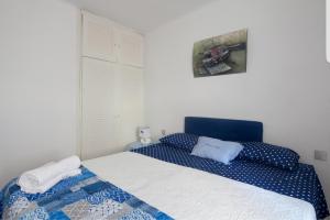 Posteľ alebo postele v izbe v ubytovaní ControVento Apartament II