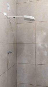 a shower with a glass door in a bathroom at Suite no Centro Wi-Fi DISP in Boa Vista