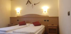 Katil atau katil-katil dalam bilik di Albergo Bernard