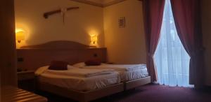Katil atau katil-katil dalam bilik di Albergo Bernard