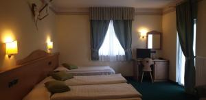 Katil atau katil-katil dalam bilik di Albergo Bernard