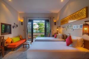Voodi või voodid majutusasutuse Hoi An Chic - Green Retreat toas