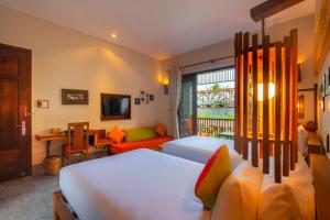 Voodi või voodid majutusasutuse Hoi An Chic - Green Retreat toas