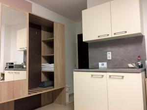 Kuchyň nebo kuchyňský kout v ubytování Hana Aparthotel