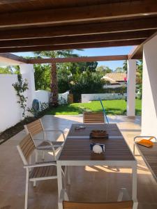 a patio with a table and two chairs at Villa Denni in Ermioni