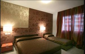 Postel nebo postele na pokoji v ubytování Residence San Marino