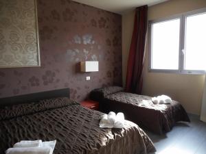 Postel nebo postele na pokoji v ubytování Residence San Marino