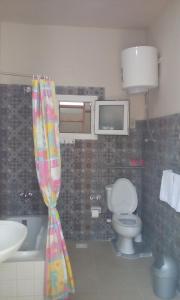 a bathroom with a toilet and a sink at Tarbouche House Dahab in Dahab