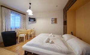 Łóżko lub łóżka w pokoju w obiekcie Appartement Mamas Iglu